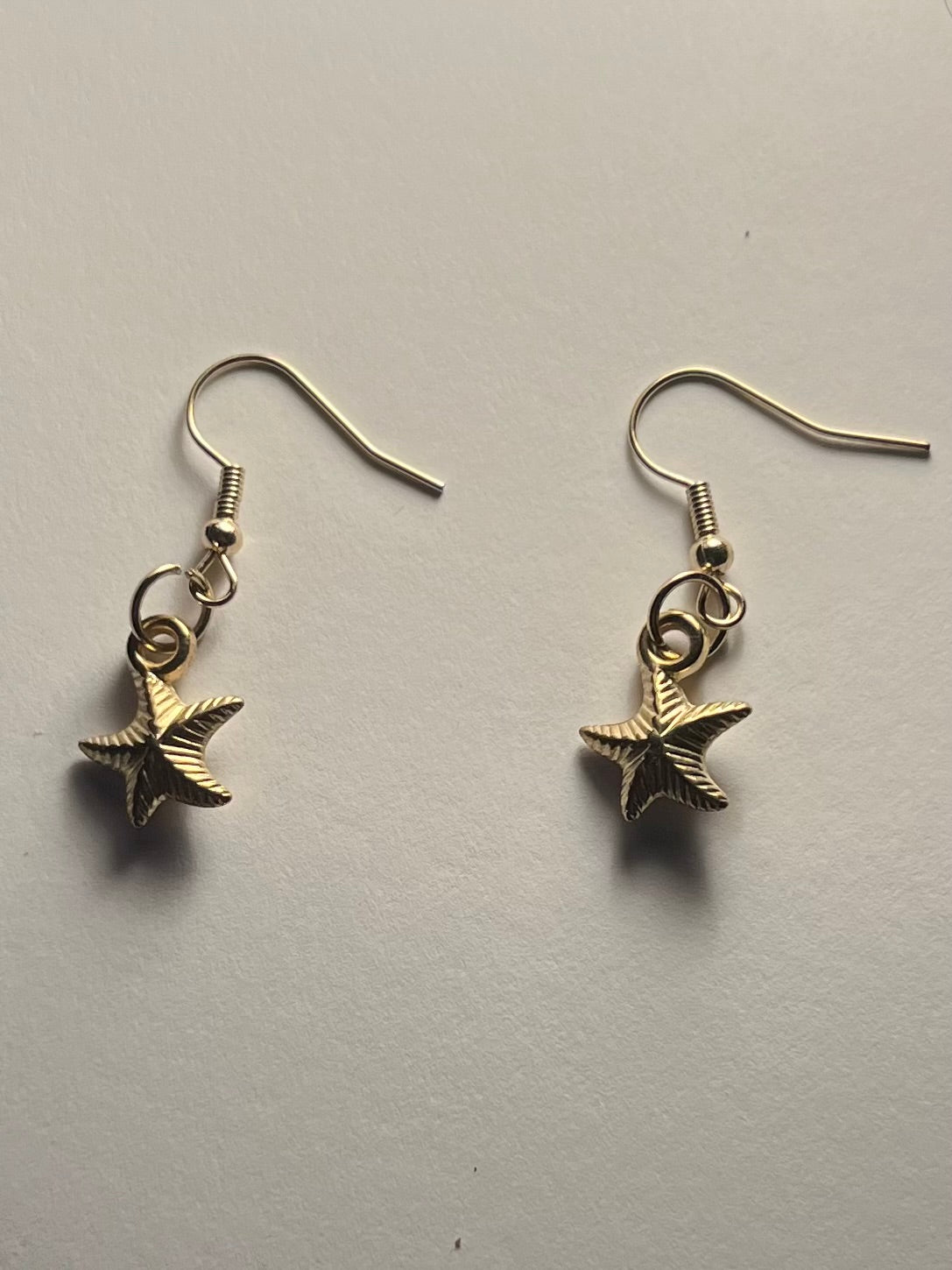 singular gold beach star earrings