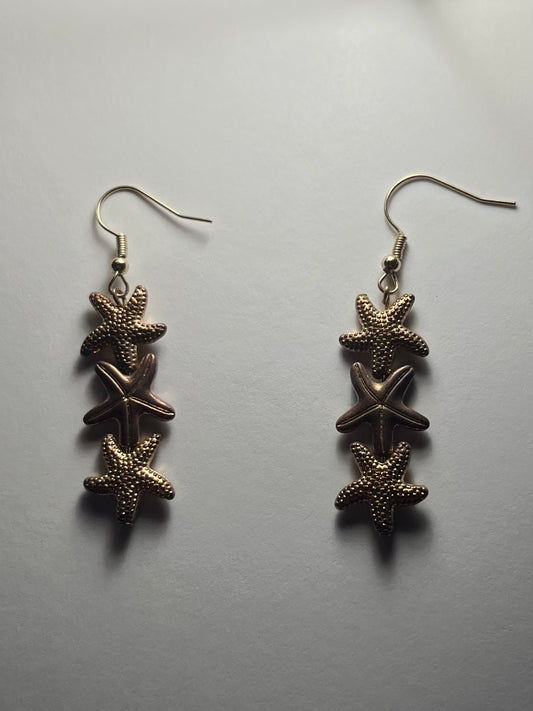 Gold star fish earrings